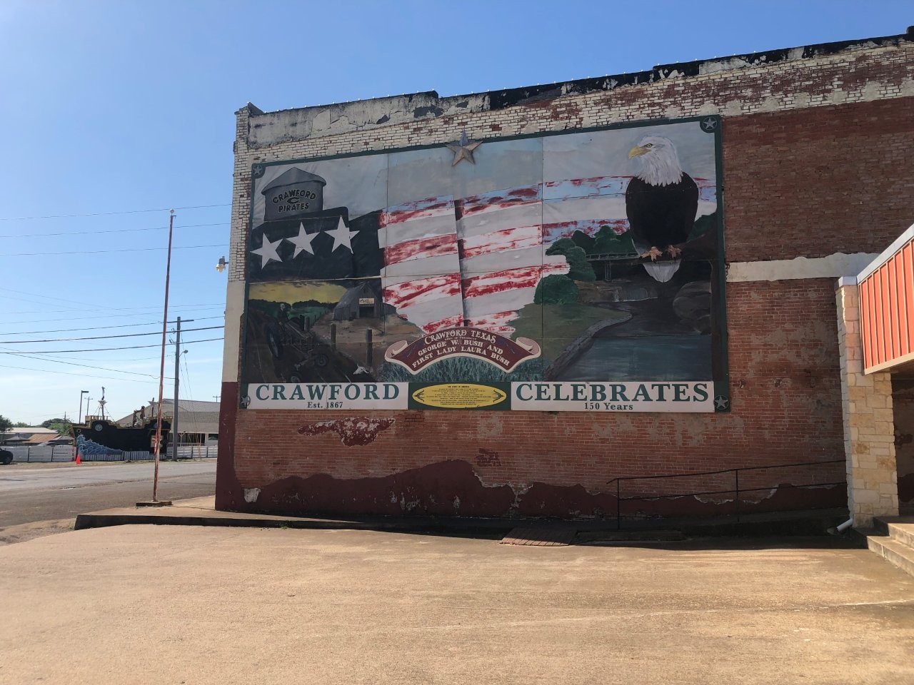 Mural in Crawford, Texas stating it is the home of George W. Bush