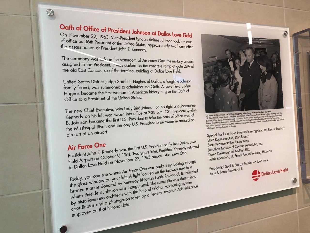 Historical markers inside terminal at Dallas Love field about Lyndon Johnson taking oath of office on airplane